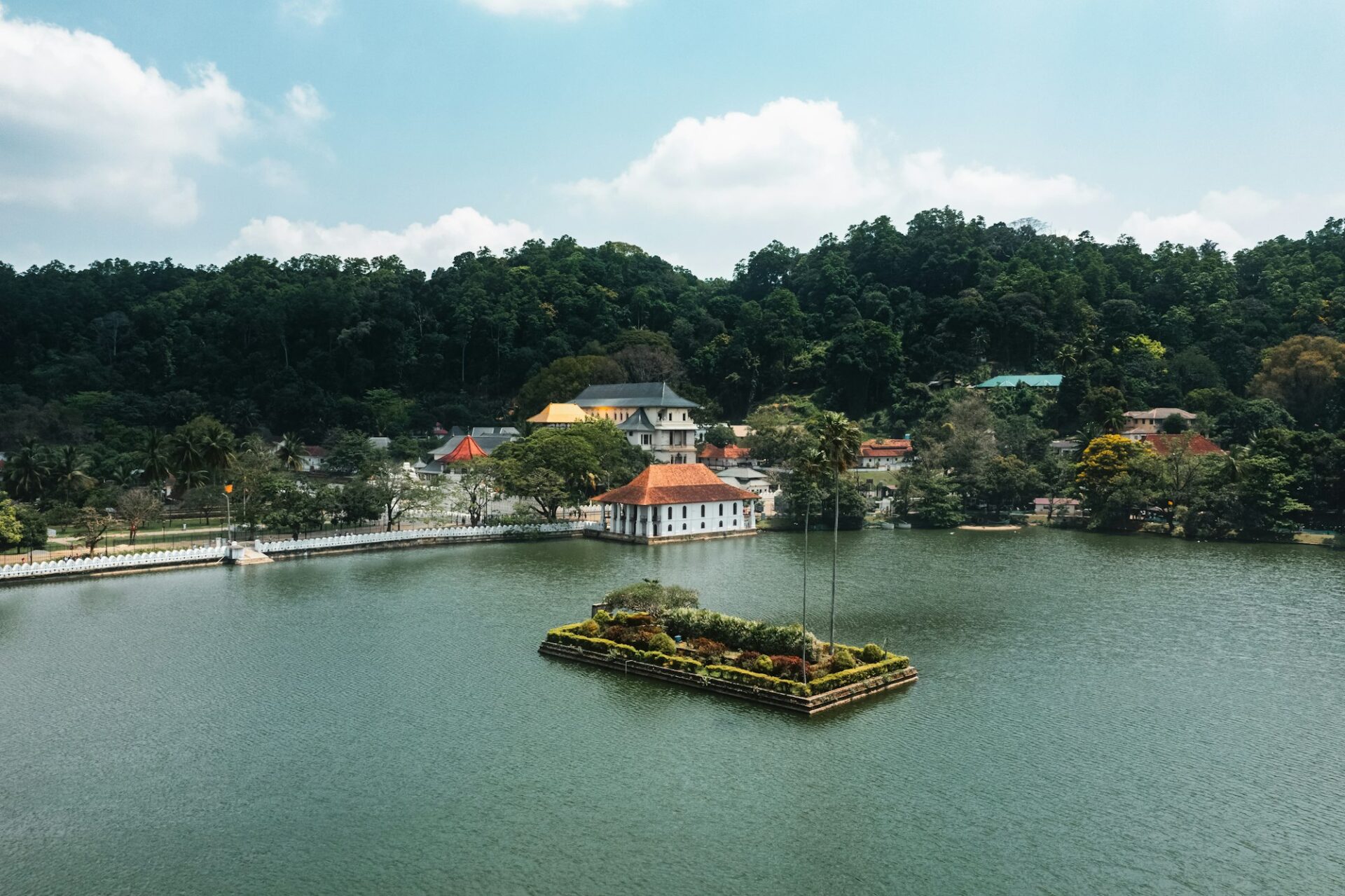 Aerial drone view of Kandy lake and famous city landmark Sri Dalada Maligawa Temple in Sri Lanka.